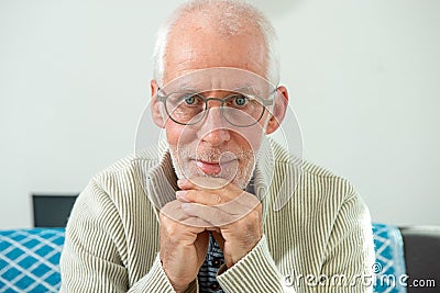 Senior with grey hairs wearing eyeglasses Stock Photo