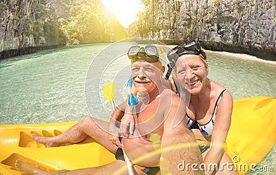 Senior happy couple taking selfie on kayak in Palawan Stock Photo
