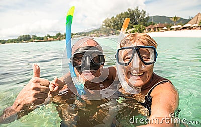 Senior happy couple taking selfie with scuba snorkeling masks Stock Photo