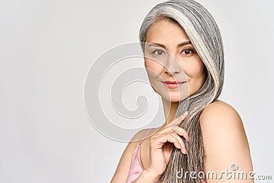 Senior happy middle aged mature asian woman headshot portrait. Hair care advertising. Stock Photo