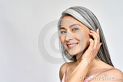 Senior happy middle aged mature asian woman headshot portrait. Skin care advertising. Stock Photo