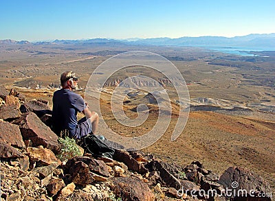 Senior hiker enjoying view of Lake Mead, Nevada. Editorial Stock Photo