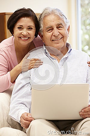 Senior Hispanic couple with laptop Stock Photo