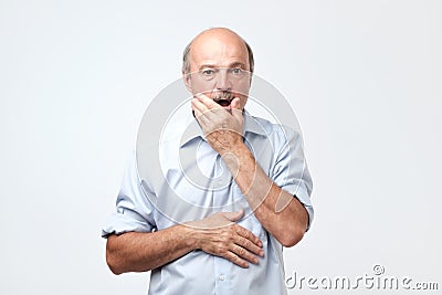 Senior hispanic man looking puzzled and confused. Stock Photo