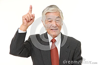 Senior Japanese businessman pointing up Stock Photo