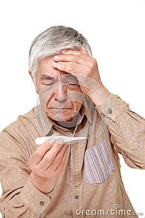 Senior Japanese man with fever Stock Photo