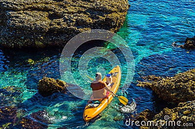 Senior kayaker on a kayak by the sea, active water sport and lei Editorial Stock Photo