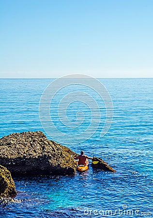 Senior kayaker on a kayak by the sea, active water sport and lei Editorial Stock Photo