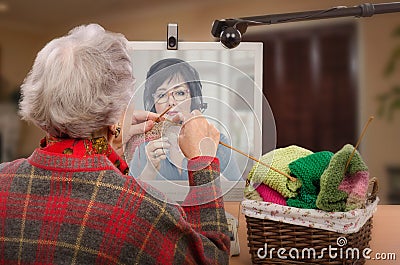 Senior knitter with her adult learner online Stock Photo