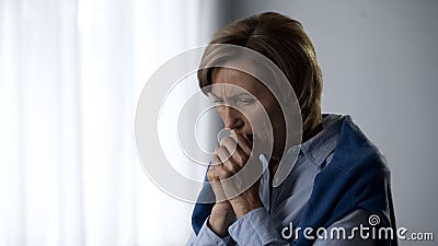 Senior lady feeling cold in apartment, high gas tariffs, housing and utilities Stock Photo