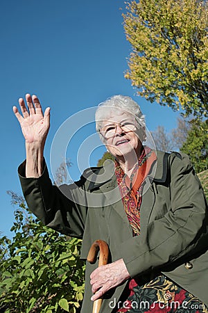 Senior lady goodbye Stock Photo