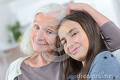 Senior lady with granddaughter happy together in domestic environment Stock Photo