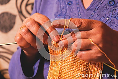 Senior lady knitting Stock Photo