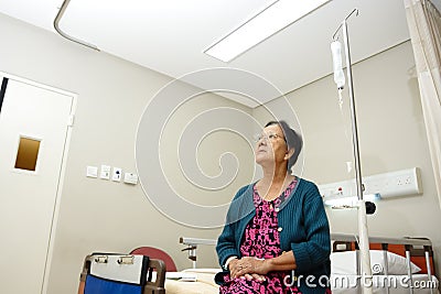 Senior lady patient in hospital ward Stock Photo