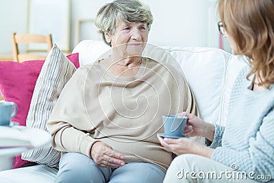 Senior lady with social worker Stock Photo