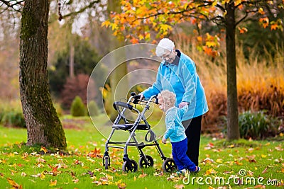 Senior lady with walker enjoying family visit Stock Photo