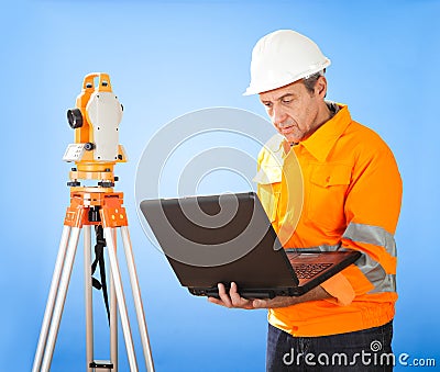 Senior land surveyor with theodolite Stock Photo