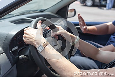 Senior learning to drive a car with a driving instructor Stock Photo