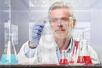 Senior life science research researching in modern scientific laboratory. Stock Photo