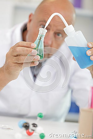 Senior male doctor portrait at clinic laboratory Stock Photo