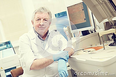 Senior male doctor portrait at clinic laboratory Stock Photo