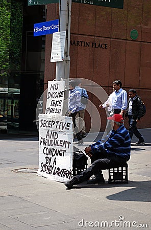 A senior male person protests at Martin Place, Sydney Editorial Stock Photo