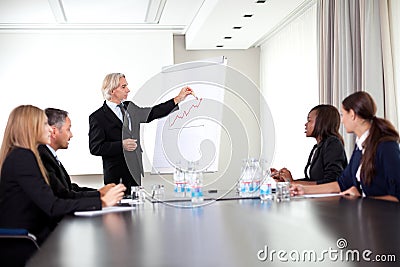 Senior male speaker giving a presentation Stock Photo