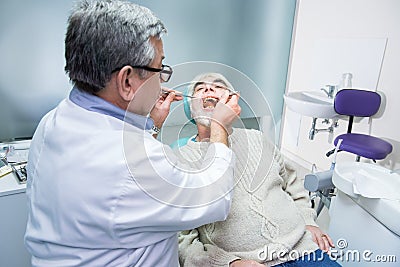 Senior male at the stomatologist. Stock Photo