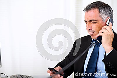 Senior male waiting on telephone Stock Photo