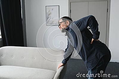 Senior man with back pain. Mature man suffering from low back pain. Old man with back pain Stock Photo