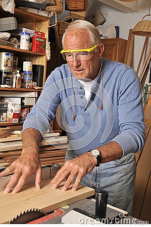 Senior Man Carpenter Working with Wood Stock Photo