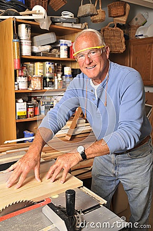 Senior Man Carpenter Working with Wood Stock Photo