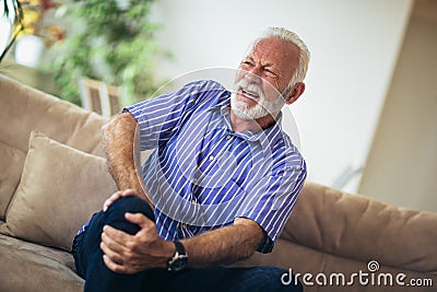 Senior man with chronic knee problems and pain Stock Photo