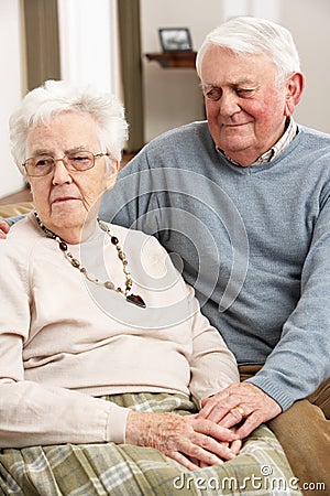 Senior Man Consoling Wife Stock Photo