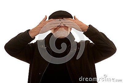 Senior man covering his eyes Stock Photo