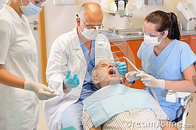 Senior man at dentist surgery have operation Stock Photo
