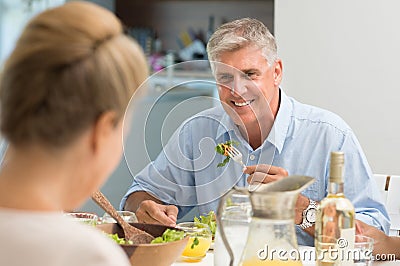 Senior man eating food Stock Photo