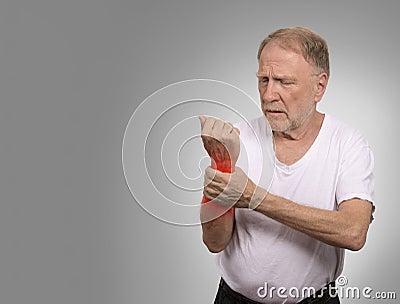 Senior man in excruciating hand ache painful wrist arthritis Stock Photo