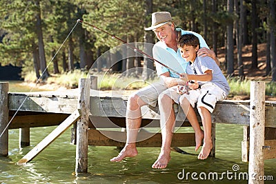 Senior man and grandson fishing Stock Photo