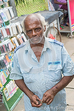 Senior man guard on the street Editorial Stock Photo