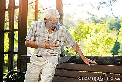 Senior man has heartache. Stock Photo