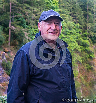 Senior Man Hiking in Forest Close Up Portrait Stock Photo