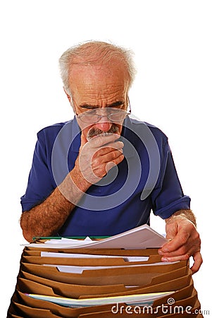 Senior man looking at paperwork Stock Photo