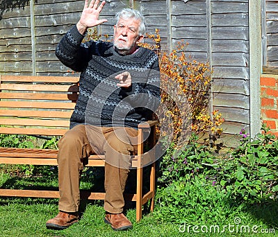Senior man hand up saying stop or halt. Stock Photo