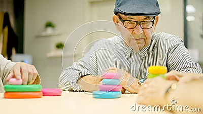 Senior man looking straight with serious look in a geriatrics Stock Photo