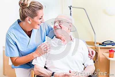 Senior man and old age nurse in nursing home Stock Photo