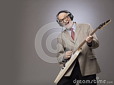 Senior man playing electric guitar Stock Photo