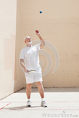 Senior Man Plays Racquetball Stock Photo