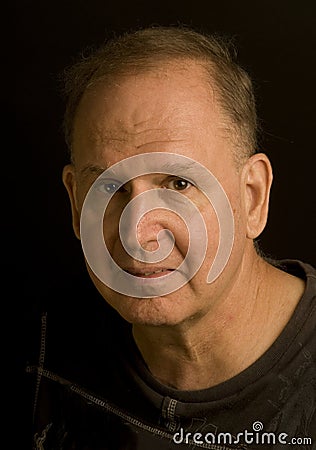 Senior man retired head shot portrait in tee shirt Stock Photo