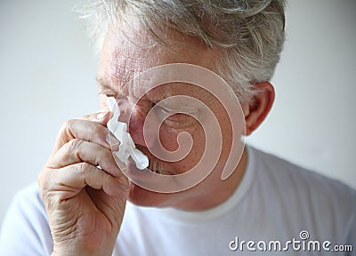 Senior man with runny nose Stock Photo